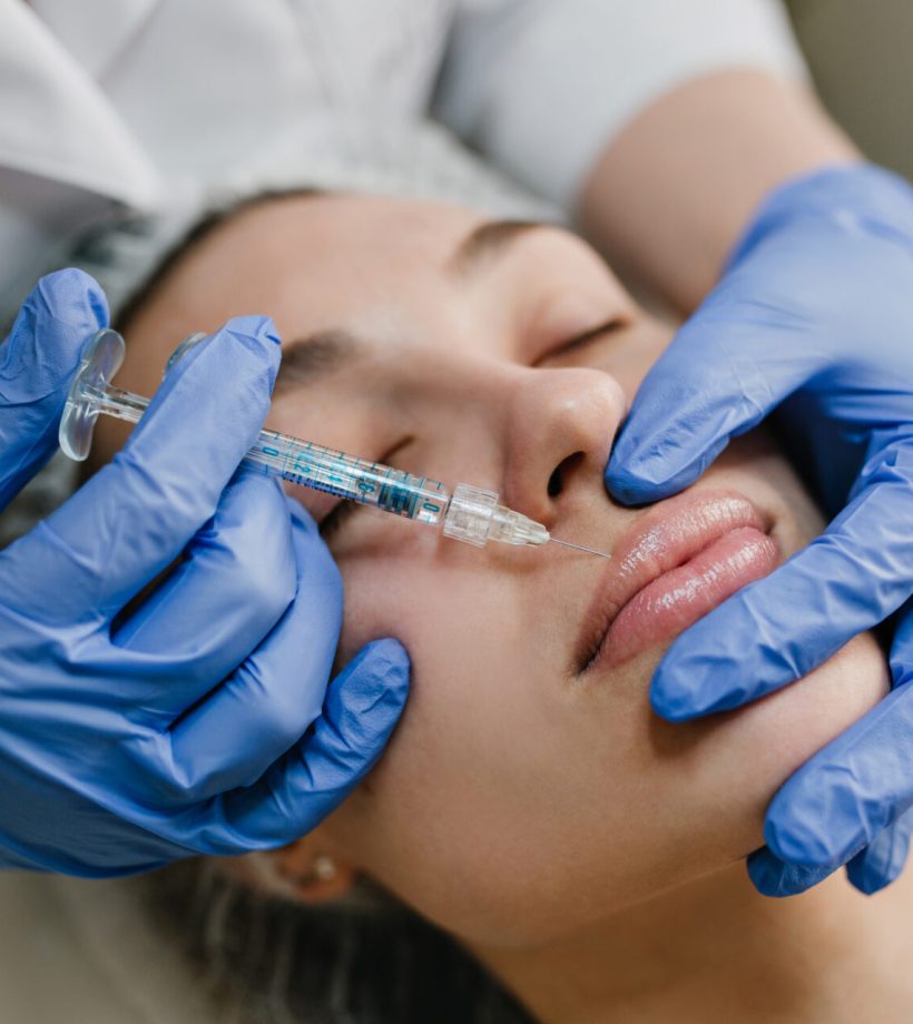 closeup-portrait-young-woman-doing-botox-procedures-by-professional-injection-making-lips-modern-devices-technology-medicine-cosmetology-therapy